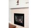 A cozy fireplace with a tiled mantel, ready to warm up your living space at 9481 Longstone Dr, Parker, CO 80134