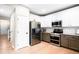 Bright kitchen with stainless steel appliances, granite countertops, and white cabinetry at 9481 Longstone Dr, Parker, CO 80134