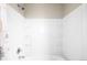 A clean and bright bathroom shower and tub combo featuring built in shelves at 9481 Longstone Dr, Parker, CO 80134