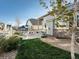 Beautiful backyard with manicured lawn, stone accents, and a patio seating area at 27110 E Fremont Pl, Aurora, CO 80016