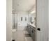 Bright bathroom with double vanity, large soaking tub, and separate glass enclosed shower at 27110 E Fremont Pl, Aurora, CO 80016