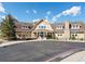 Exterior view of the clubhouse with a welcoming entrance and well-maintained landscaping at 27110 E Fremont Pl, Aurora, CO 80016