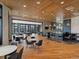 Spacious clubhouse interior featuring a bar area, tables, and chairs for community gatherings at 27110 E Fremont Pl, Aurora, CO 80016