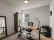 Functional office space with a modern desk, storage cabinet, and natural light at 27110 E Fremont Pl, Aurora, CO 80016