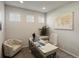 Bright office featuring a large wooden desk, comfortable chair, and a decorative world map at 27110 E Fremont Pl, Aurora, CO 80016