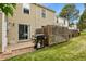 Cozy backyard patio with a grill and a well-maintained lawn, perfect for outdoor gatherings at 8879 W Floyd Ave, Lakewood, CO 80227