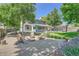 Relaxing backyard oasis with fire pit, mature trees, and comfortable seating at 6494 W 85Th Ave, Arvada, CO 80003