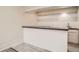 Basement bar area with white subway tile backsplash and sink at 6494 W 85Th Ave, Arvada, CO 80003