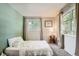 Bright bedroom with large windows, neutral colors, carpet flooring, and a comfortable bed at 6494 W 85Th Ave, Arvada, CO 80003
