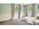 Bedroom with two windows, gray curtains, neutral walls, and gray carpet at 6494 W 85Th Ave, Arvada, CO 80003