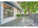 Inviting front porch with a wood floor, potted plants, and architectural details at 6494 W 85Th Ave, Arvada, CO 80003