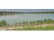 Peaceful view of Lake Arbor lake with mountains in the distance at 6494 W 85Th Ave, Arvada, CO 80003