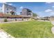 Manicured backyard featuring lush green lawn and hillside landscaping at 42741 Ivydel Cir, Elizabeth, CO 80107