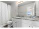 Well-lit bathroom features a double vanity with granite countertop and modern fixtures at 42741 Ivydel Cir, Elizabeth, CO 80107