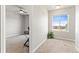 Neutral-toned bedroom with carpet flooring, a window with scenic views, and a ceiling fan at 42741 Ivydel Cir, Elizabeth, CO 80107