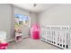 Bright, kid-friendly bedroom features neutral carpet, a window, and a princess tent at 42741 Ivydel Cir, Elizabeth, CO 80107