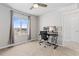 Bright bedroom with a ceiling fan, large window, and comfortable desk set up at 42741 Ivydel Cir, Elizabeth, CO 80107