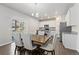 Elegant dining area with a wooden table, upholstered chairs, and a view of the backyard at 42741 Ivydel Cir, Elizabeth, CO 80107