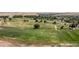 Expansive view of the golf course, showcasing the lush greenery and meticulously maintained grounds at 42741 Ivydel Cir, Elizabeth, CO 80107