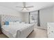 Main bedroom features a large bed, soft carpet, neutral walls, and natural light at 42741 Ivydel Cir, Elizabeth, CO 80107