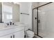 Clean bathroom with white subway tiles, a glass shower, and modern vanity at 4993 Hickory Oaks St, Castle Rock, CO 80104