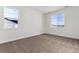 Bright bedroom with neutral carpeting and large windows offering ample natural light at 4993 Hickory Oaks St, Castle Rock, CO 80104