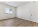 Well-lit bedroom with hardwood floors and a large window at 4993 Hickory Oaks St, Castle Rock, CO 80104