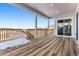 Spacious deck with sliding glass door access and distant mountain views at 4993 Hickory Oaks St, Castle Rock, CO 80104