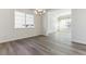 Bright dining room with hardwood floors and a chandelier at 4993 Hickory Oaks St, Castle Rock, CO 80104