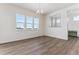 Bright dining room features hardwood floors and large windows with scenic views at 4993 Hickory Oaks St, Castle Rock, CO 80104