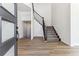 Bright entryway with hardwood floors and a modern staircase at 4993 Hickory Oaks St, Castle Rock, CO 80104