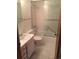 Clean bathroom with white tile, shower with glass door, and vanity with storage at 31270 John Wallace Rd # 310, Evergreen, CO 80439