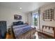 Stylish bedroom with modern decor, including a bright window and contemporary furnishings at 31270 John Wallace Rd # 310, Evergreen, CO 80439