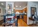 Well-lit kitchen with stainless steel appliances, black countertop breakfast bar, and hardwood flooring at 31270 John Wallace Rd # 310, Evergreen, CO 80439