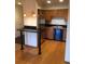 Efficient kitchen layout with stainless steel refrigerator, wooden cabinets, and a cozy breakfast bar at 31270 John Wallace Rd # 310, Evergreen, CO 80439