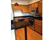 Bright kitchen features stainless steel appliances, wooden cabinetry, and a convenient breakfast bar at 31270 John Wallace Rd # 310, Evergreen, CO 80439
