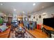 Inviting living room area showcasing an open floor plan with hardwood floors, dining area, and kitchen at 31270 John Wallace Rd # 310, Evergreen, CO 80439
