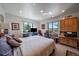 Spacious main bedroom with two windows, providing ample natural light and scenic views at 31270 John Wallace Rd # 310, Evergreen, CO 80439