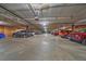 Large parking garage with multiple vehicles parked in assigned spots at 31270 John Wallace Rd # 310, Evergreen, CO 80439