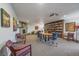 Recreation room featuring a cozy fireplace, bookshelves, and seating area at 31270 John Wallace Rd # 310, Evergreen, CO 80439