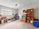 Basement storage with carpet, bright lighting, window, and ample room for organizing at 4182 S Bahama St, Aurora, CO 80013