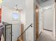 Bright entryway featuring tile floors, staircase, coat closet, and access to the upper and lower levels at 4182 S Bahama St, Aurora, CO 80013