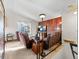 Comfortable living area features wood accent wall, large window, and plush seating at 4182 S Bahama St, Aurora, CO 80013