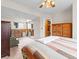 Spacious main bedroom with a ceiling fan, and view of a walk-in closet at 4182 S Bahama St, Aurora, CO 80013