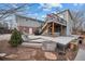 Multi-level deck with hot tub and backyard access at 7636 S Eaton Way, Littleton, CO 80128