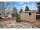 Tan shed in the backyard with stone pathway at 7636 S Eaton Way, Littleton, CO 80128