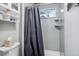 Clean bathroom with a shower/tub combo and gray walls at 7636 S Eaton Way, Littleton, CO 80128