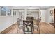 Small dining area with glass-top table and four chairs at 7636 S Eaton Way, Littleton, CO 80128