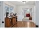 Charming dining area with a wooden buffet and a view into the living room at 7636 S Eaton Way, Littleton, CO 80128