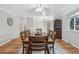 Bright dining room with wood table and chairs at 7636 S Eaton Way, Littleton, CO 80128